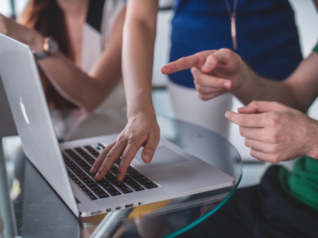 person-touching-and-pointing-macbook-pro-zkbzlifgkgw